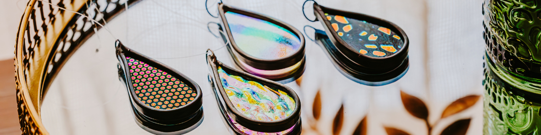 a set of 4 miniature dichroic teardrop shaped car charms