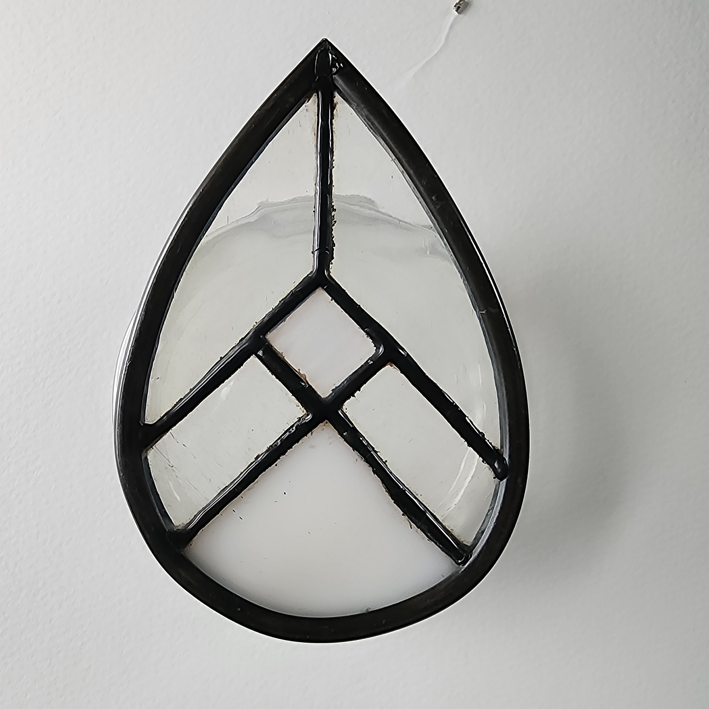White geometric stained glass suncatcher  on a neutral background