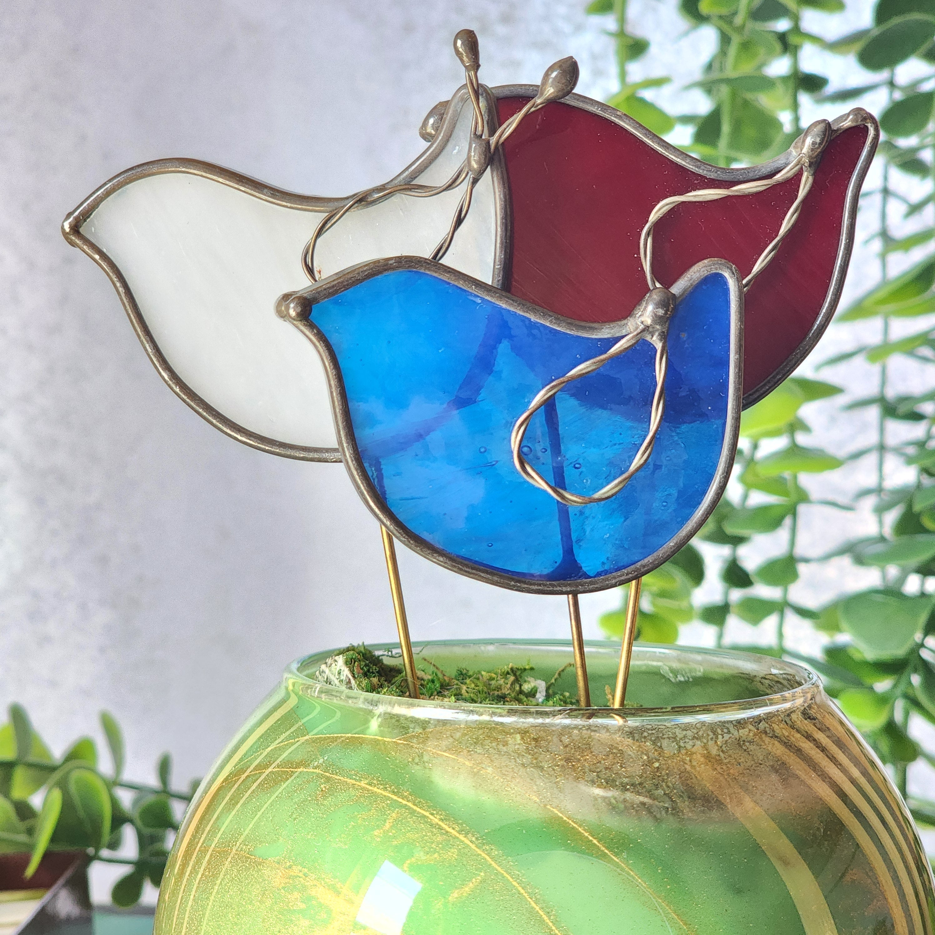 Stained glass bird plant stakes in Red, White, Blue on a white background