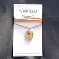 Fused glass pendant on a card with 'Thomas Critchlow Art Glass' branding.