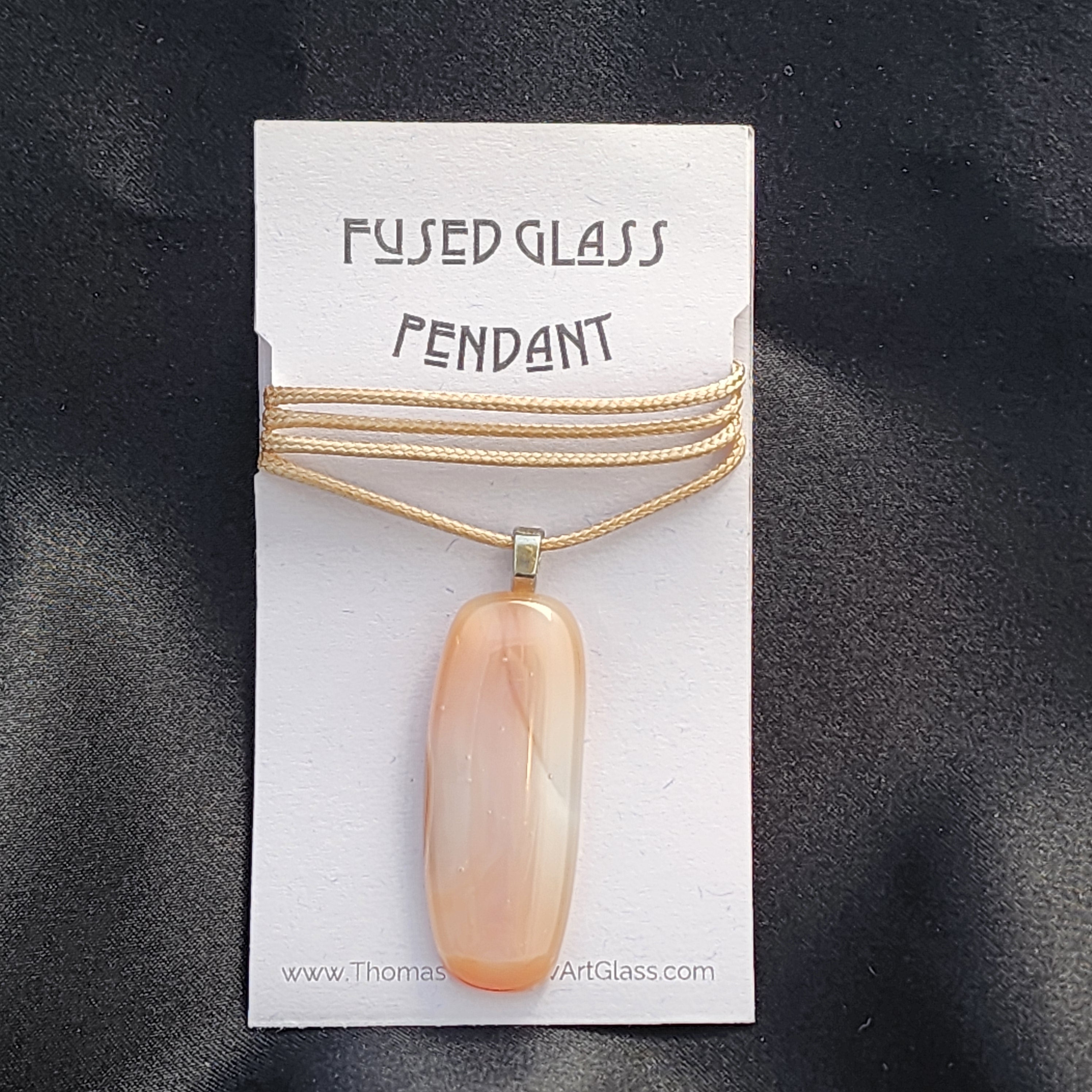 Fused glass pendant necklace on a display card with 'Thomas ArtGlass' branding.
