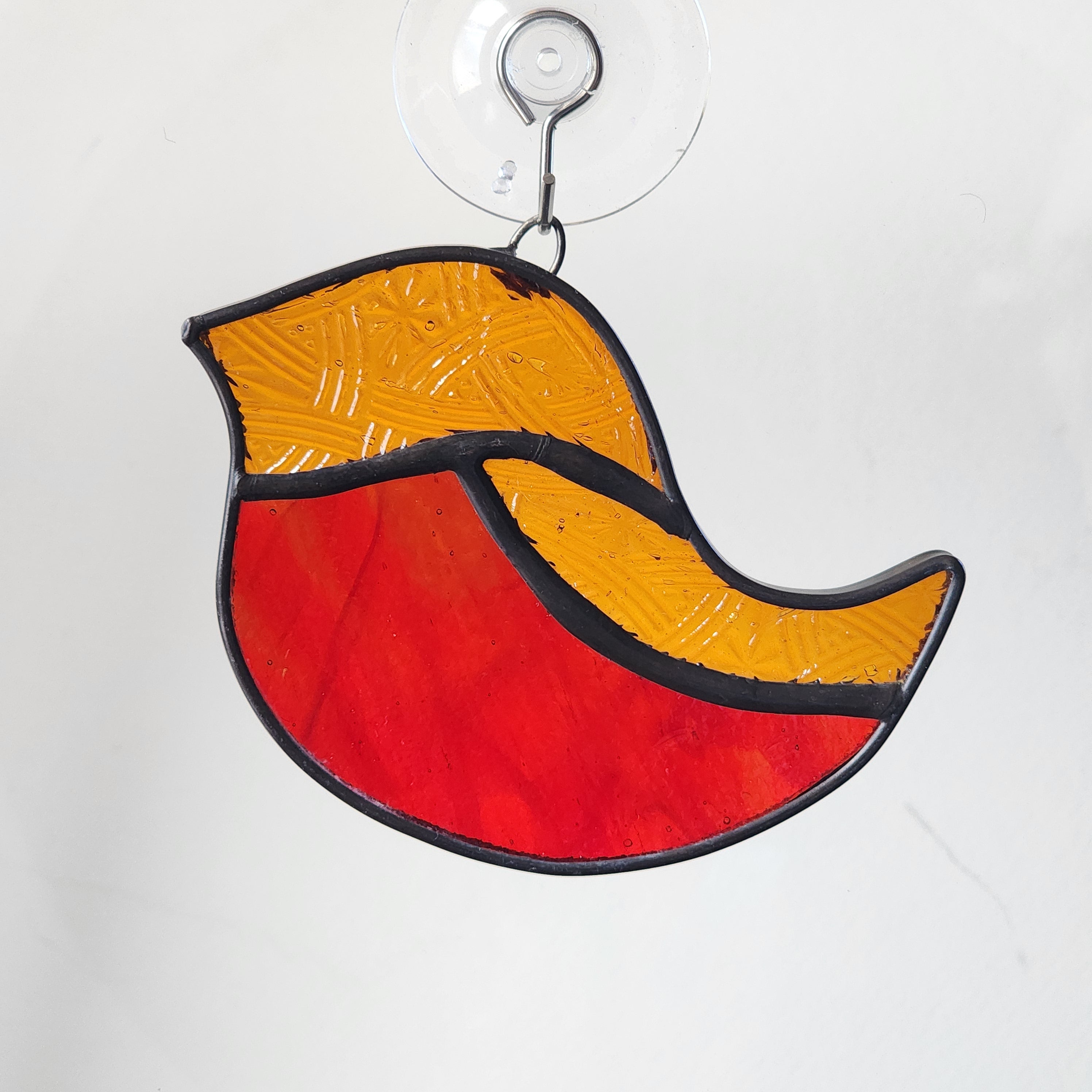 Amber and red stained glass robin