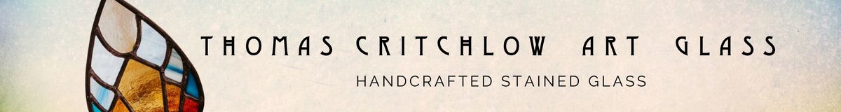 Logo of Thomas Critchlow Art Glass with stained glass design and text on a blurred background