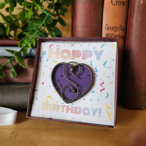 Purple heart in birthday gift box